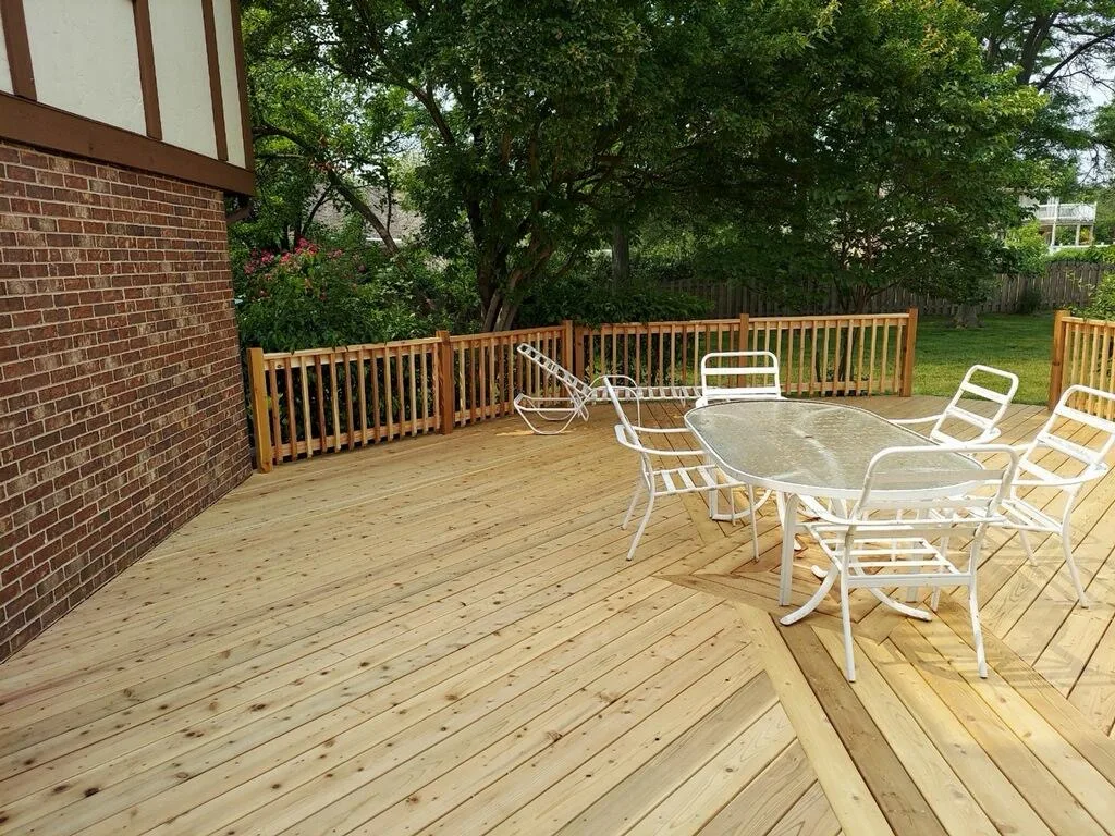 New wood deck with railing built by JMRA Construction
