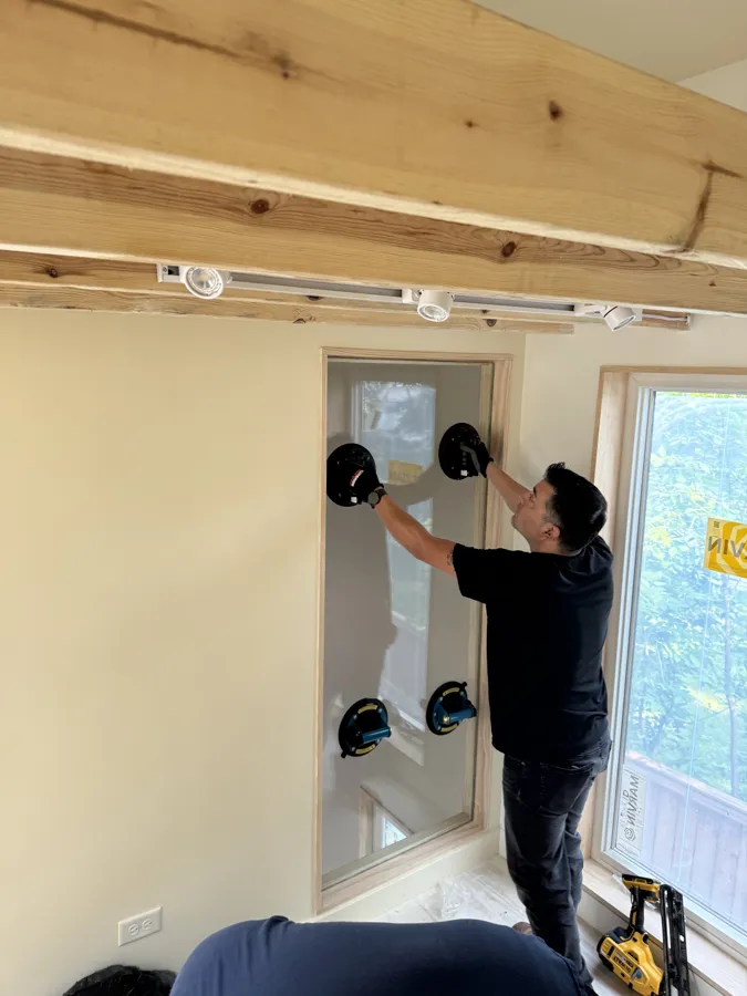 Interior glass panel installation in a new home